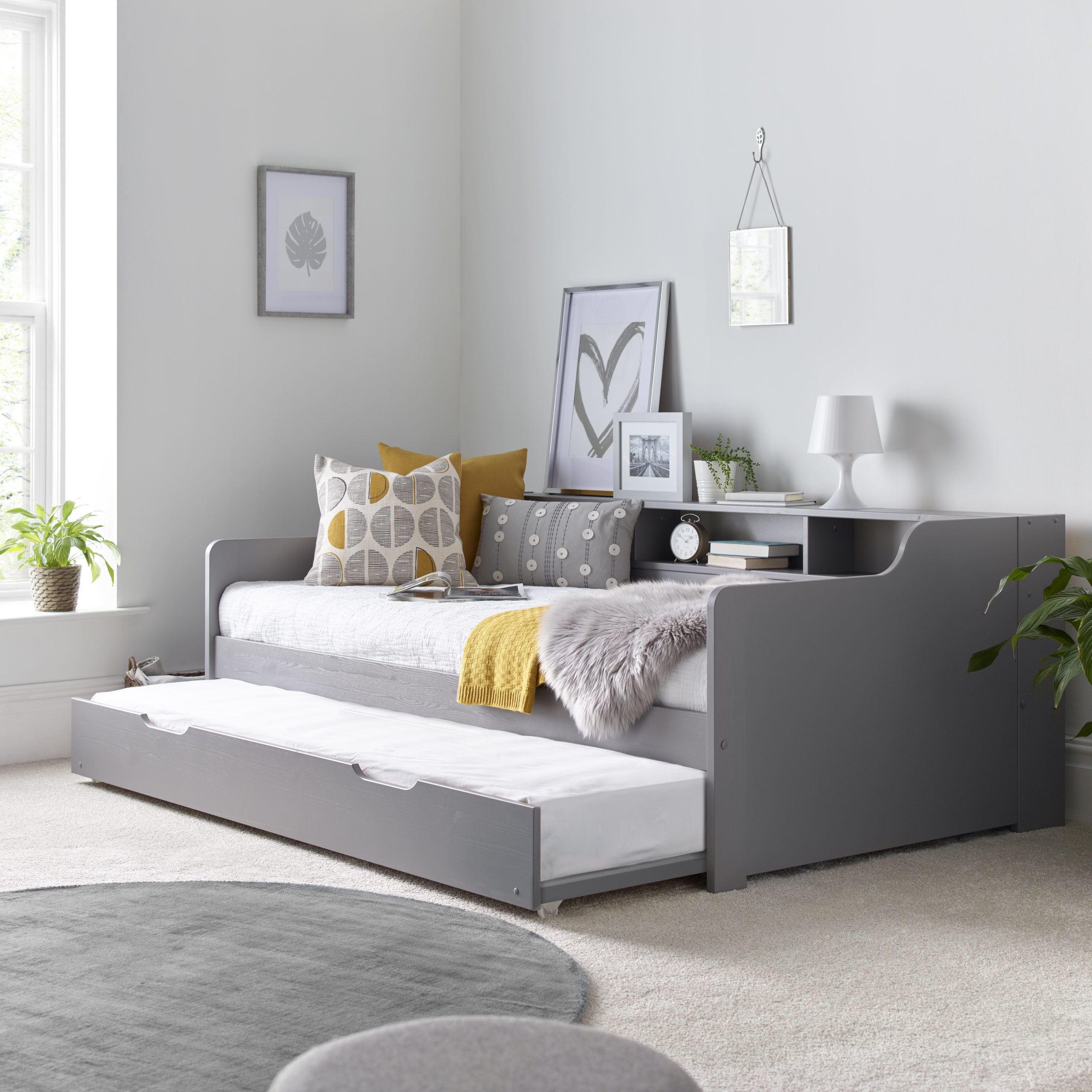 The Mercury Grey Guest Bed is a nice, comfy bed that doesn't take up too much space. It has shelves for extra storage. You can use it as a bed or a sofa. It's made of strong pine wood to last a long time. Its simple, modern colour looks good in any bedroom.