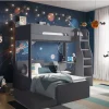 Jubilee L-Shaped Bunk Bed For a space-efficient bedroom arrangement, consider the Jubilee L-shaped Bunk Bed. This unit offers two distinct sleeping areas while optimizing available floor space for additional furnishings. The upper bunk incorporates a substantial storage shelf for organized personal items. The lower bunk is equipped with an integrated desk, suitable for work or study. The under-bed component is also independent, allowing for relocation to accommodate space requirements or the insertion of an optional drawer unit. Constructed from laminated particle board, this bed features a neutral grey finish, complementing diverse bedroom aesthetics. The ladder is reversible, permitting assembly on either the left or right side of the bed. Key Features and Benefits: Laminated Particle Board Construction L-shaped Bunk Configuration with Two Single Beds Integrated Shelving on Upper Bunk Wide Steps for Convenient Upper Bunk Access