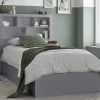 The Oscar Grey Wooden Ottoman Storage Bed! This bed is all about style and smart storage, making it a great fit for teen bedrooms or any space where you need to save room. It’s got a sleek Grey finish and a modern vibe, plus a handy bookcase headboard that's perfect for keeping your books, decorations, or anything else you might need right at hand. Underneath the mattress, there's a roomy storage area that’s easy to access with a gas-piston lift, and you can open it from either side depending on your room setup. Made with top-notch materials, this bed is sturdy and built to last, making it a great pick for teens who need both extra space and some style.