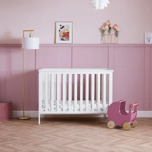 The Pensham Mini cot bed is designed to accommodate your child's growth. Suitable from birth to approximately three years of age, its three-position mattress height provides an appropriate setting for each developmental milestone. Transitioning to a toddler bed is facilitated by the simple removal of the sides, creating a comfortable sleeping space. An optional under-drawer is also available, offering convenient additional storage for your child's belongings.