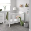 The Clara Mini cot bed is characterized by its compact design, while retaining the essential features of the full-sized model. This makes it an ideal choice for individuals who appreciate the aesthetic and functionality of the Clara cot bed but have spatial constraints. This elegant mini cot bed incorporates open slatted sides, facilitating observation of an infant during periods of rest. Furthermore, the inclusion of teething rails serves to protect delicate teeth. The mattress base is adjustable to three different heights, allowing for increased security and reassurance as a child progresses through developmental milestones such as sitting and standing. The cot bed can be readily transformed into a cosy and stylish junior bed by simply detaching the fixed sides and splitting the end panels. This conversion process minimizes disruption during a child's transitional stages, ensuring maximum durability and excellent value.