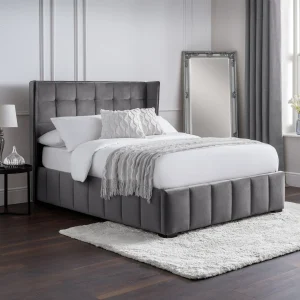Enjoy classic style with the Safina Bed. It's designed to look classy and elegant. The best part is its beautiful winged headboard, which makes your bedroom feel more special. The bed is covered in a soft light grey velvet that feels luxurious. The detailed headboard also gives it a modern look that fits well with its classic feel. Make your bedroom look amazing with this bed, where every detail is fancy and will last.
